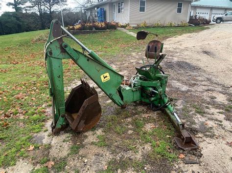 jd skid steer backhoe attachment|john deere 165 backhoe attachment.